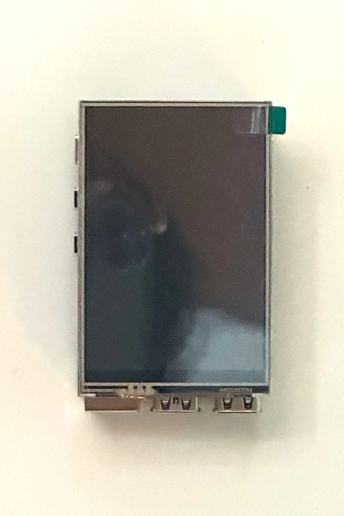 A touchscreen LCD seated on top of the Raspberry Pi